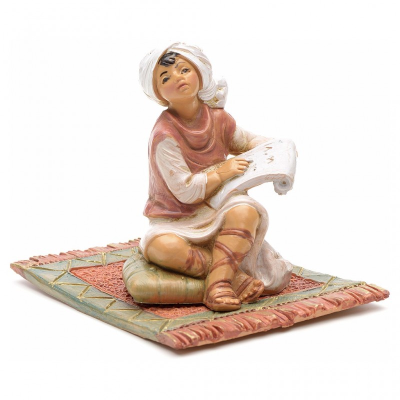 Bambino che legge su tappeto