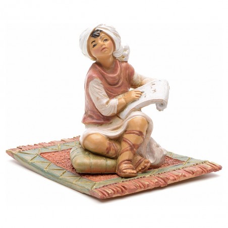 Bambino che legge su tappeto