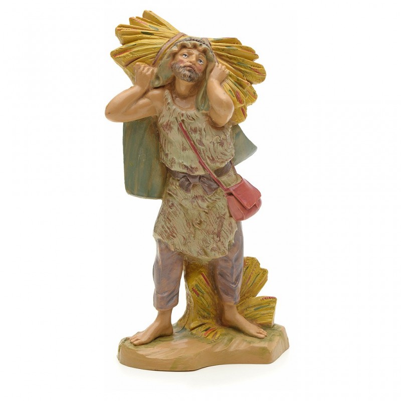 Contadino con fieno in spalla