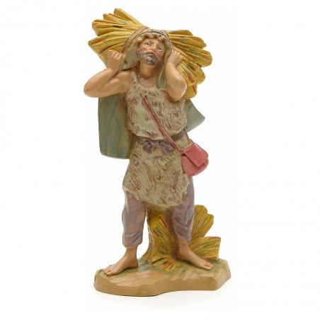 Contadino con fieno in spalla