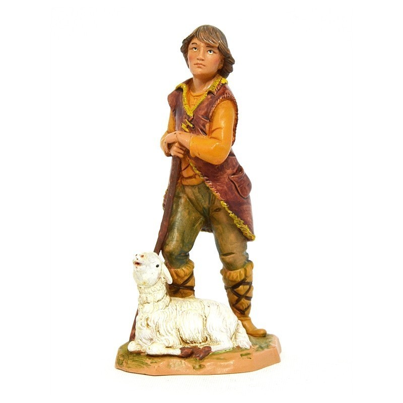 Pastore con pecora seduta