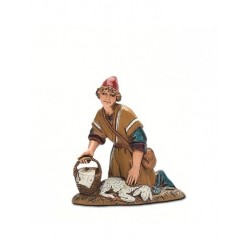 Inginocchiato con pecora