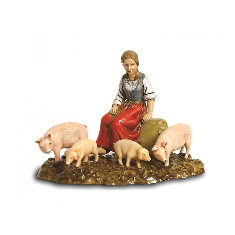 Donna seduta con maiali