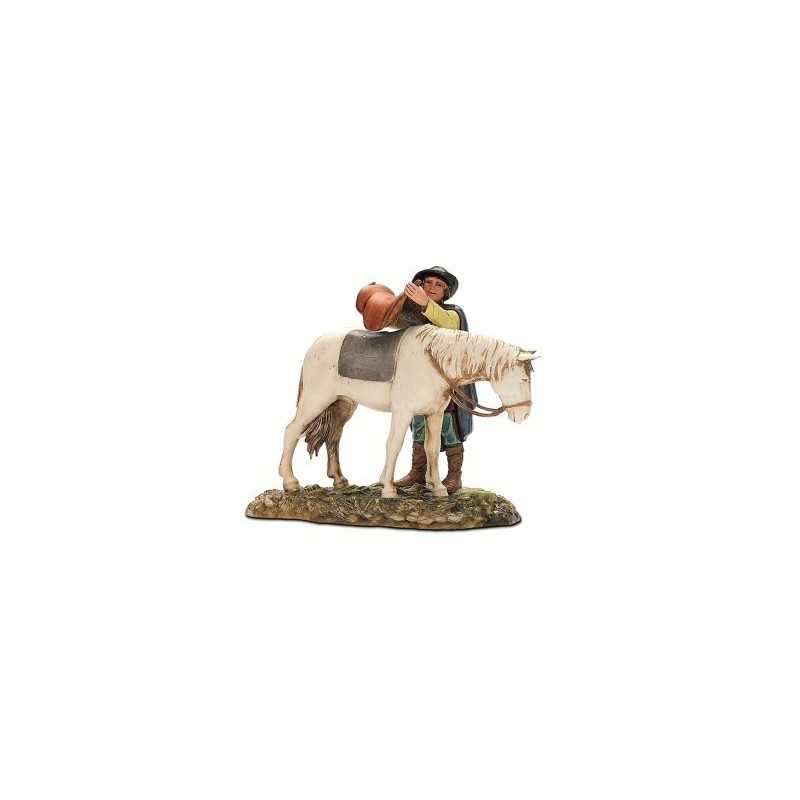 Uomo che sella cavallo