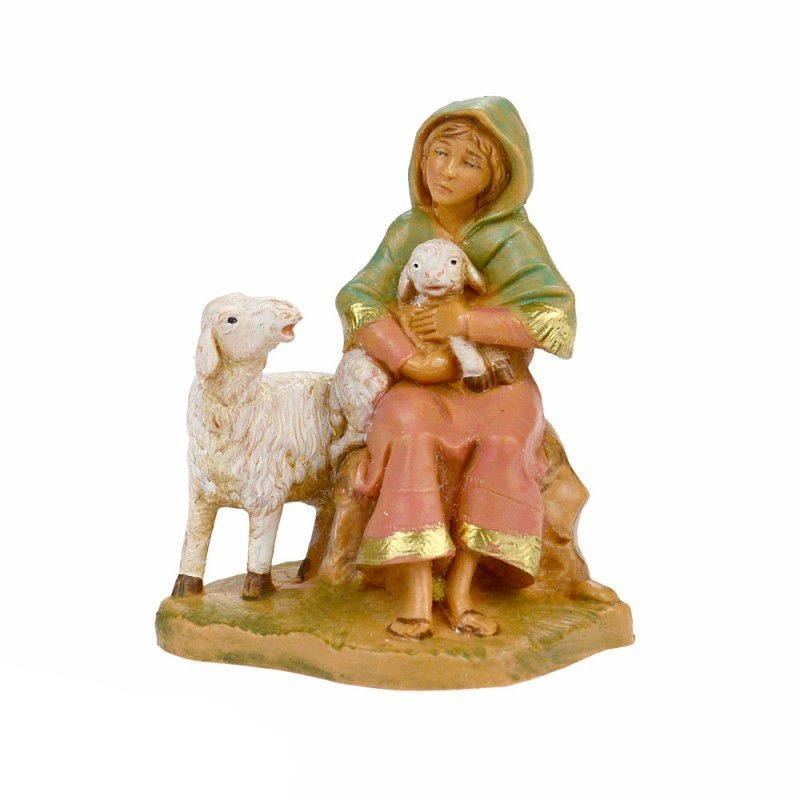 Donna seduta con pecore